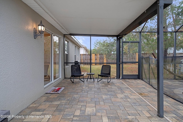 unfurnished sunroom with plenty of natural light