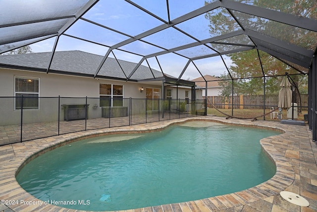 view of pool with a lanai and a patio area