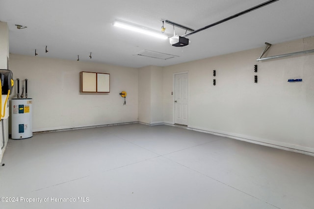 garage featuring electric water heater and a garage door opener