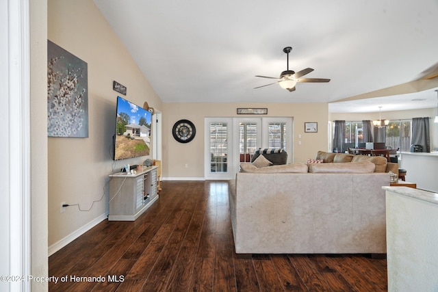 unfurnished living room with dark hardwood / wood-style flooring, a healthy amount of sunlight, and vaulted ceiling