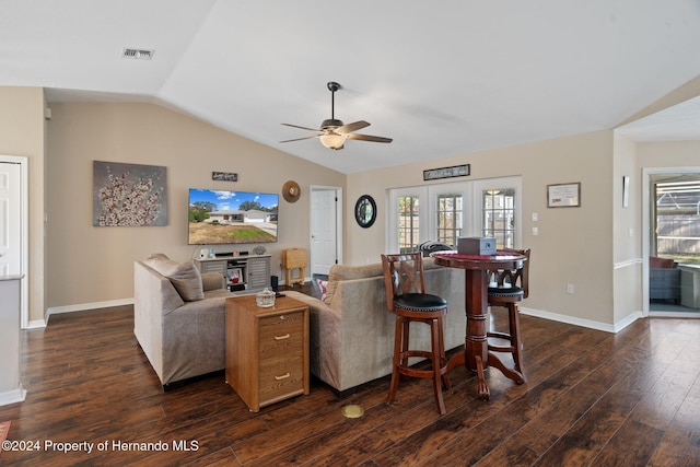 living room with ceiling fan, dark hardwood / wood-style flooring, and lofted ceiling