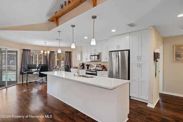 kitchen with dark hardwood / wood-style floors, white cabinetry, a kitchen island with sink, and appliances with stainless steel finishes