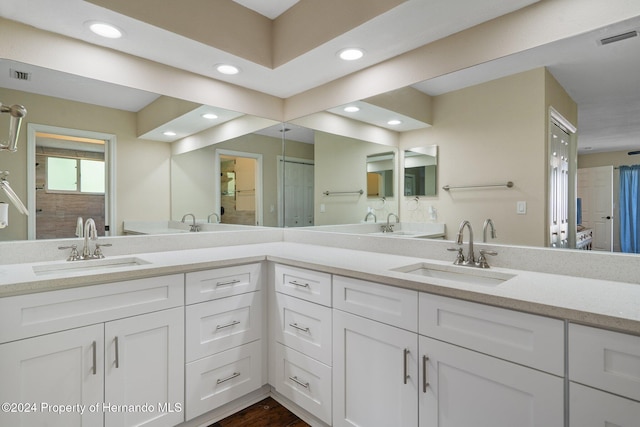 bathroom featuring vanity and hardwood / wood-style flooring