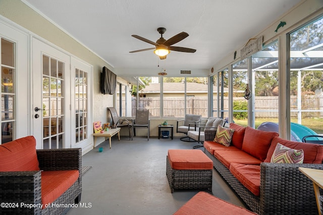 sunroom / solarium featuring ceiling fan and a healthy amount of sunlight