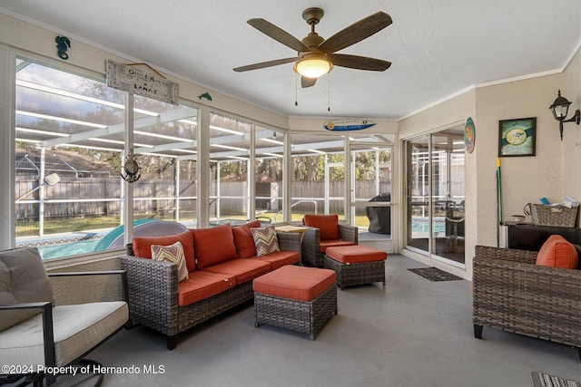 sunroom featuring ceiling fan and a healthy amount of sunlight