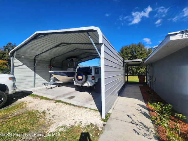 view of parking / parking lot with a carport