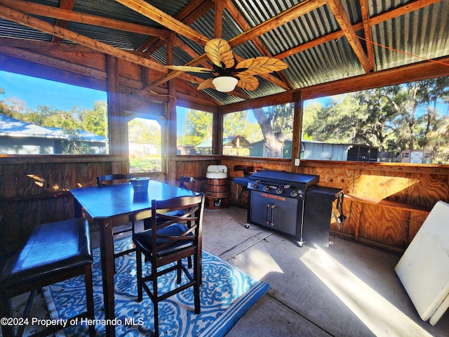 view of patio / terrace featuring an outdoor bar, area for grilling, and ceiling fan