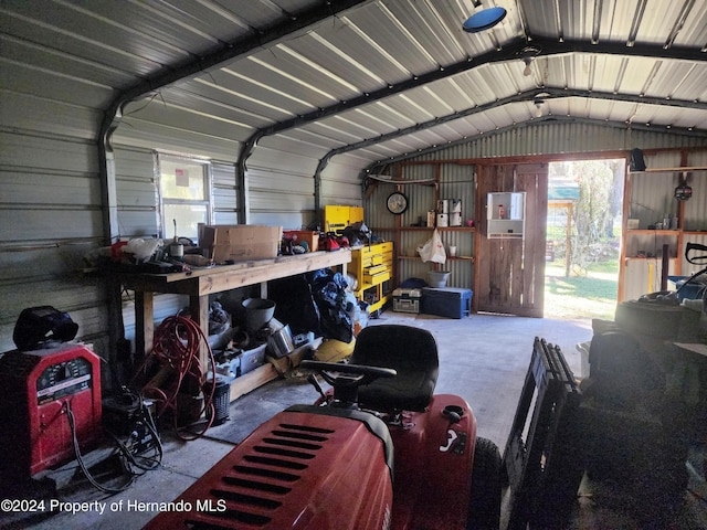 garage featuring wood walls