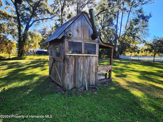 view of outdoor structure with a yard