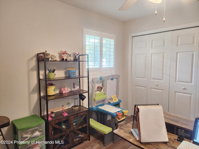 home office with hardwood / wood-style floors and ceiling fan