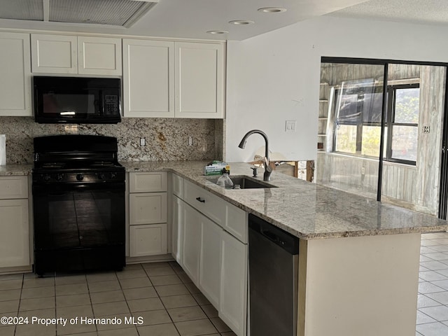 kitchen featuring kitchen peninsula, tasteful backsplash, sink, black appliances, and white cabinetry