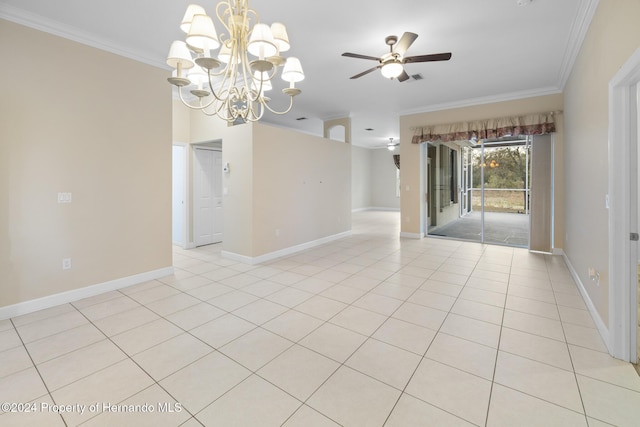 empty room featuring ceiling fan with notable chandelier, ornamental molding, and light tile patterned floors