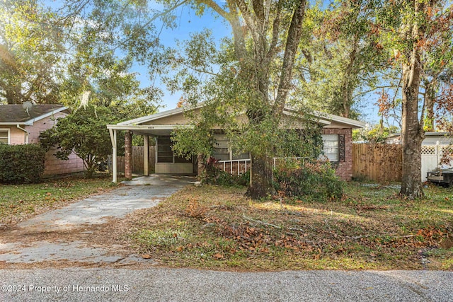 view of front facade with a carport