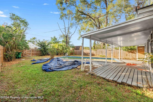 view of yard with a fenced in pool