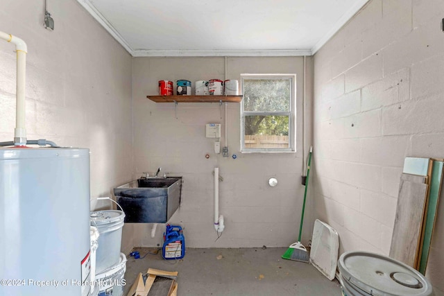 interior space featuring ornamental molding, sink, and water heater