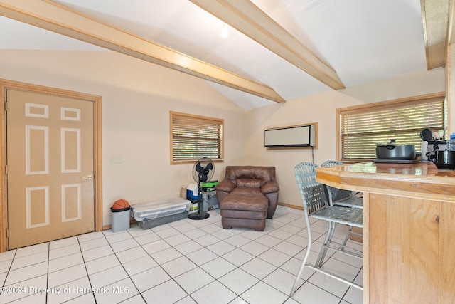 tiled office space featuring lofted ceiling with beams