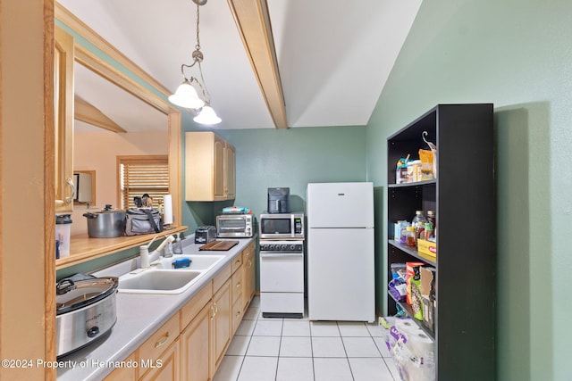 kitchen with light brown cabinets, vaulted ceiling with beams, white fridge, and sink