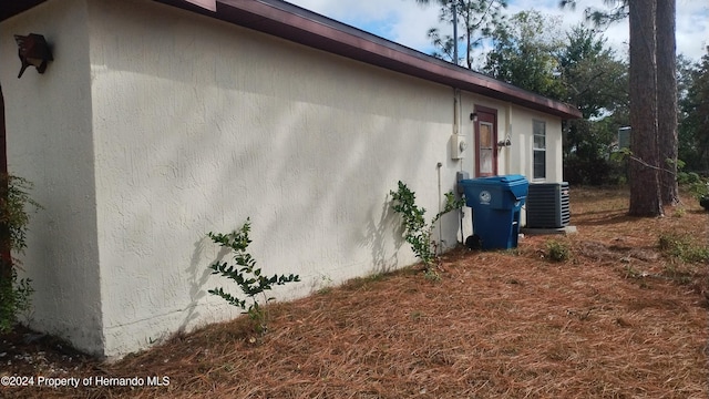 view of side of property with cooling unit