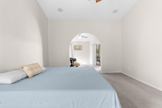 bedroom featuring carpet and lofted ceiling