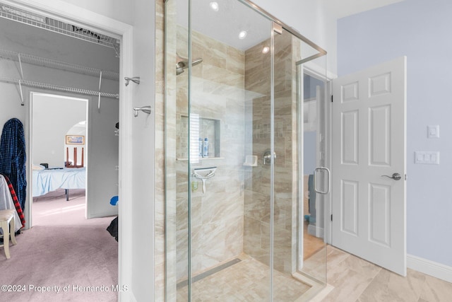 bathroom with a shower with shower door