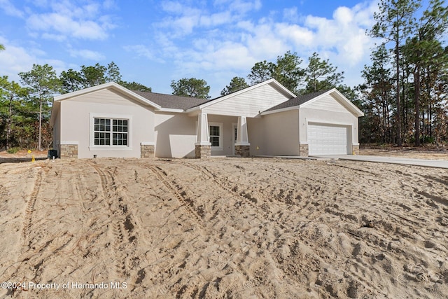 ranch-style home featuring a garage