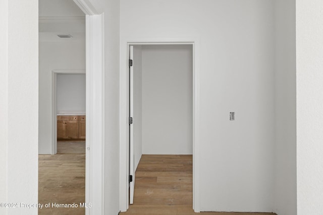 hall with light hardwood / wood-style flooring