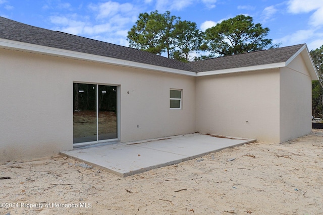 back of house with a patio area