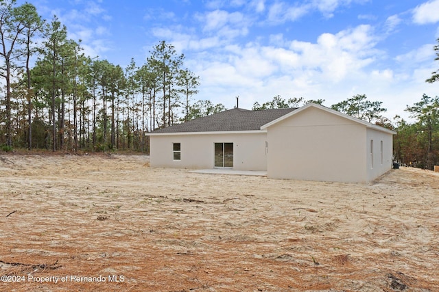 rear view of house featuring a patio