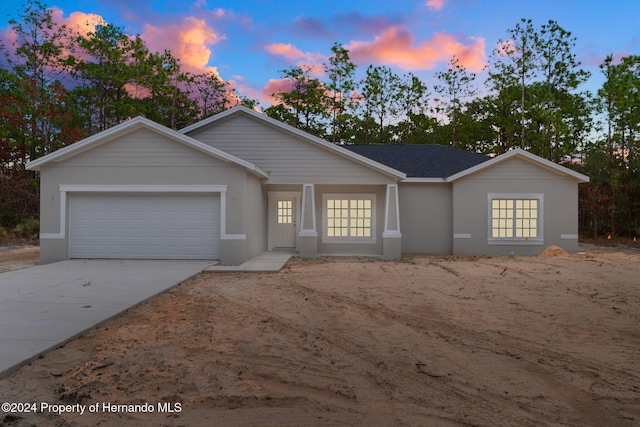 ranch-style house featuring a garage