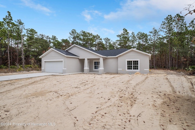 single story home with a garage