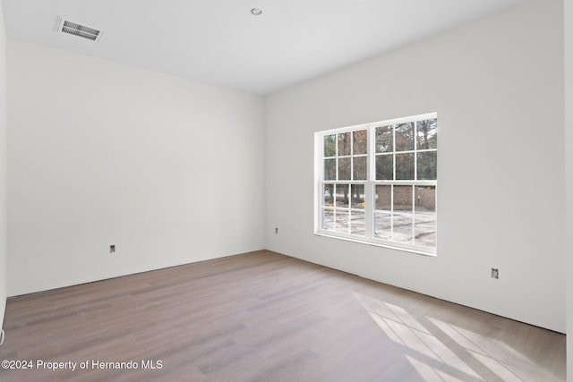 unfurnished room featuring light hardwood / wood-style flooring