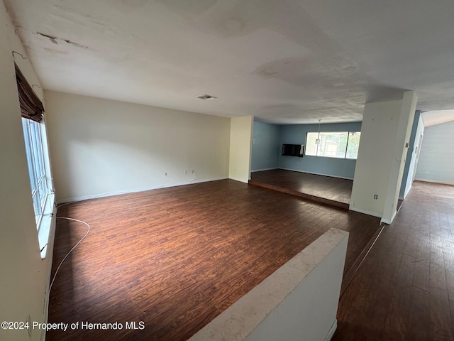 spare room featuring dark hardwood / wood-style floors