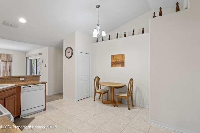 kitchen featuring dishwasher, a notable chandelier, pendant lighting, lofted ceiling, and light tile patterned flooring