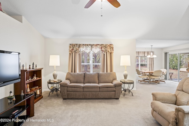 living room with light colored carpet and ceiling fan