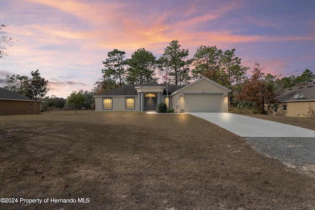 ranch-style house featuring a garage