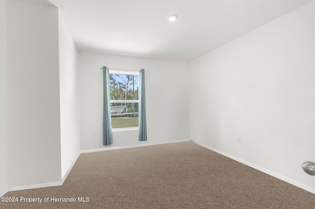 unfurnished room with carpet flooring