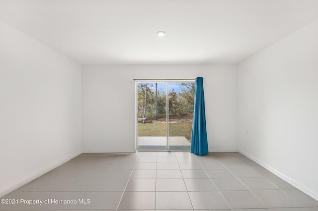 empty room with light tile patterned flooring