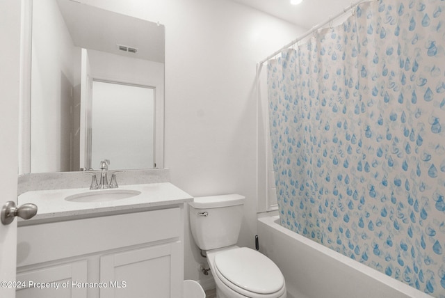 full bathroom featuring vanity, shower / bath combination with curtain, and toilet