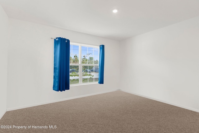 empty room featuring carpet flooring