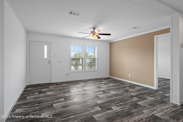 interior space with ceiling fan, dark hardwood / wood-style flooring, and ornamental molding