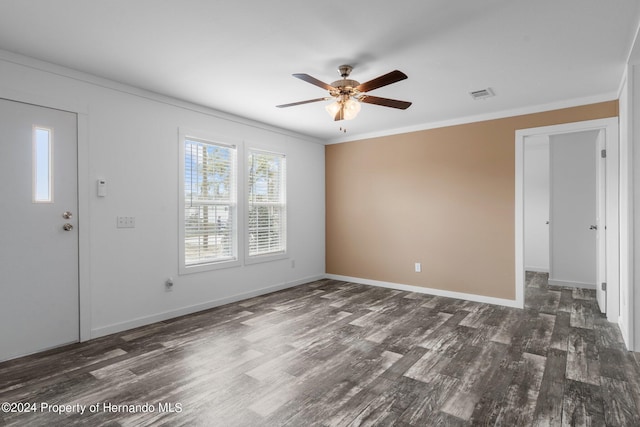 unfurnished room with ceiling fan, dark hardwood / wood-style flooring, and crown molding