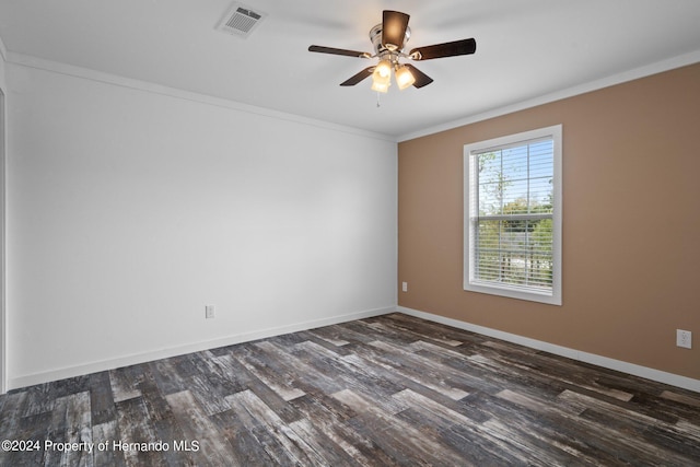 empty room featuring ceiling fan, dark hardwood / wood-style flooring, and ornamental molding