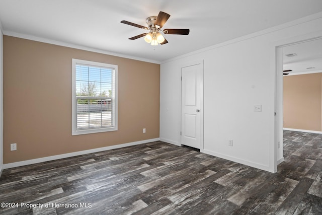 unfurnished bedroom featuring dark hardwood / wood-style flooring, ceiling fan, and ornamental molding