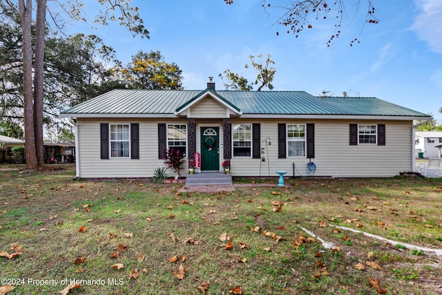 ranch-style house with a front yard