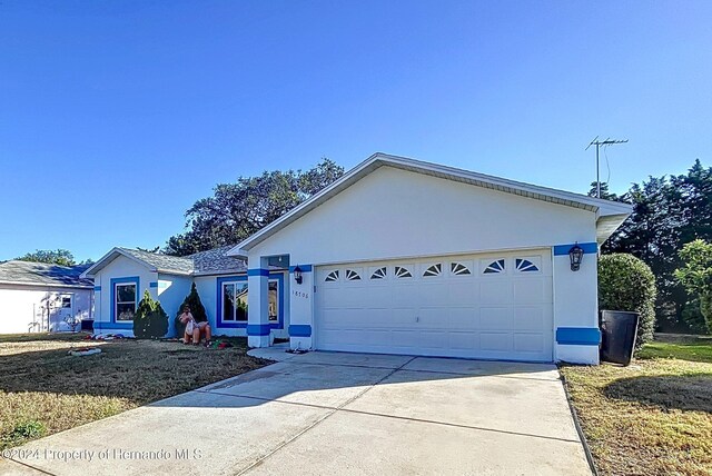 single story home featuring a garage