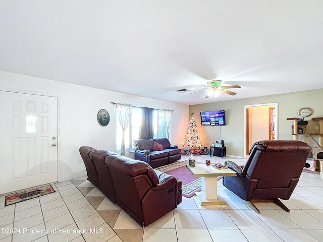 tiled living room featuring ceiling fan