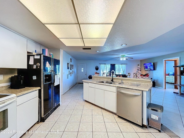 kitchen featuring white range with electric cooktop, white cabinets, sink, stainless steel dishwasher, and ceiling fan