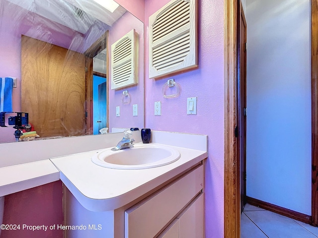 bathroom featuring tile patterned floors and vanity