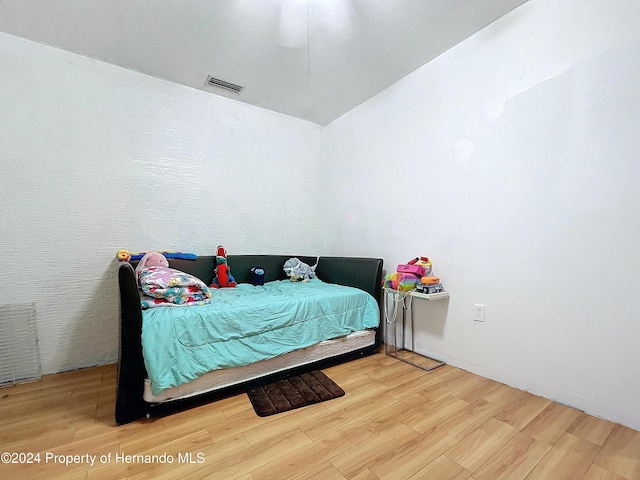 bedroom featuring hardwood / wood-style floors