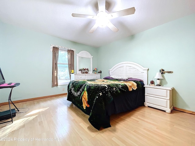 bedroom with ceiling fan and light wood-type flooring